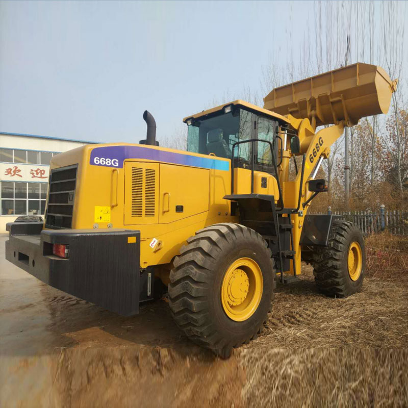 جرار محمل أمامي وجرافة خلفية